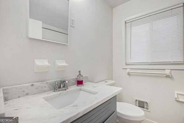 2210 Rhinehill Rd SE, Atlanta, GA 30315 - half bath with visible vents, toilet, and vanity