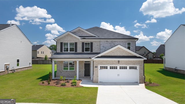 craftsman-style home featuring a front yard and a garage