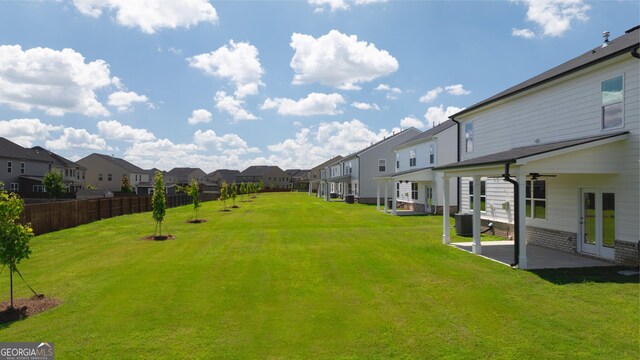 view of yard featuring cooling unit and a patio area