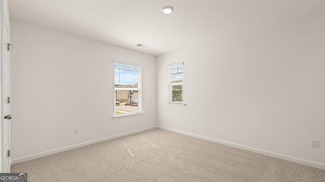 view of carpeted spare room