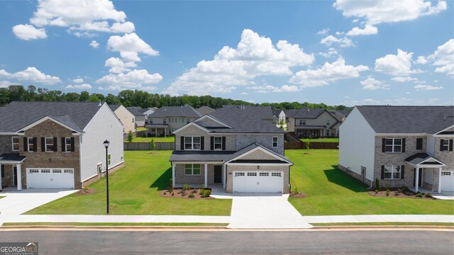 view of front facade featuring a front yard and a garage