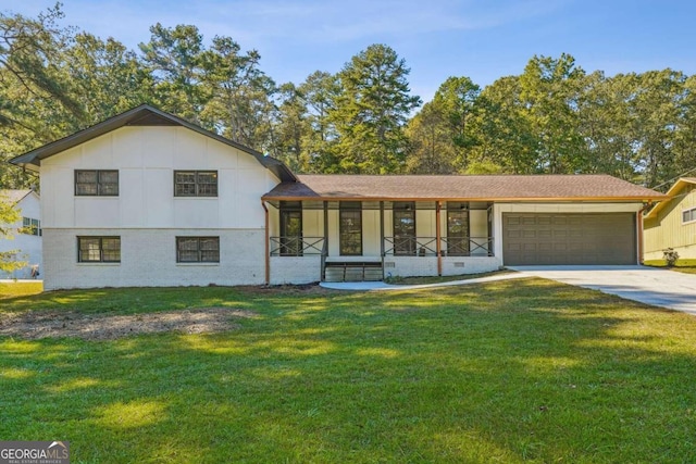 split level home featuring a front lawn and a garage