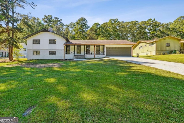 tri-level home featuring a front lawn and a garage