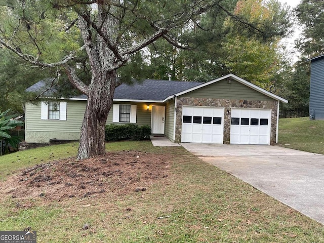 ranch-style home with a front lawn and a garage