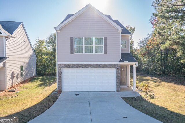 view of front facade with a front lawn and a garage