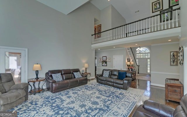 living room with hardwood / wood-style flooring, high vaulted ceiling, and plenty of natural light