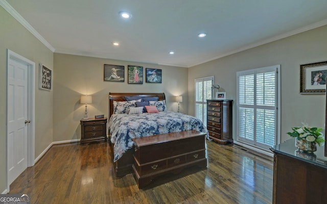 bedroom with crown molding and dark hardwood / wood-style flooring