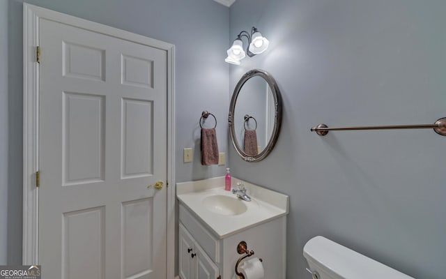 bathroom with vanity and toilet