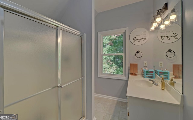 bathroom with vanity, tile patterned floors, and walk in shower