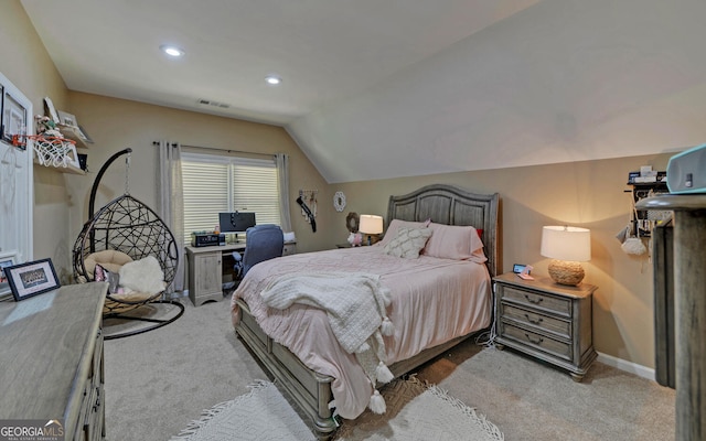 carpeted bedroom featuring lofted ceiling