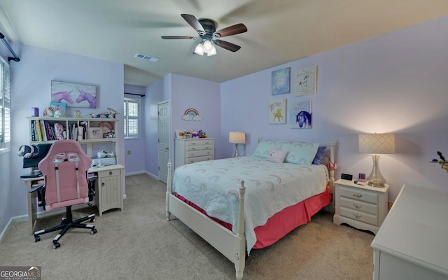 carpeted bedroom with a closet and ceiling fan