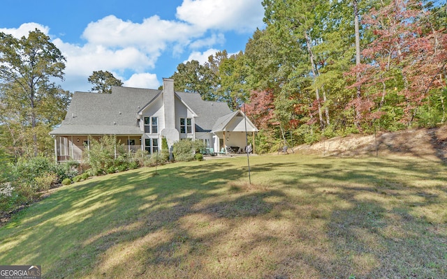 715 Cross Creek Dr, Toccoa, GA 30577 - back of house featuring a yard, a chimney, and roof with shingles