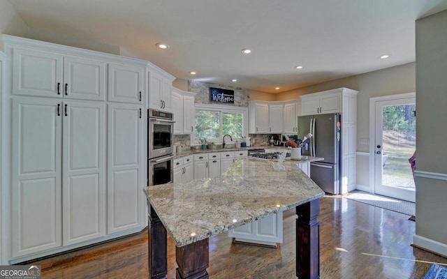715 Cross Creek Dr, Toccoa, GA 30577 - kitchen featuring stainless steel appliances, a kitchen breakfast bar, white cabinetry, a sink, and recessed lighting