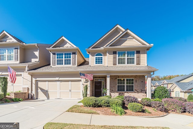 craftsman-style home featuring a garage and a porch