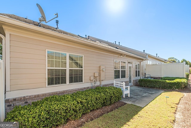 back of property with a patio