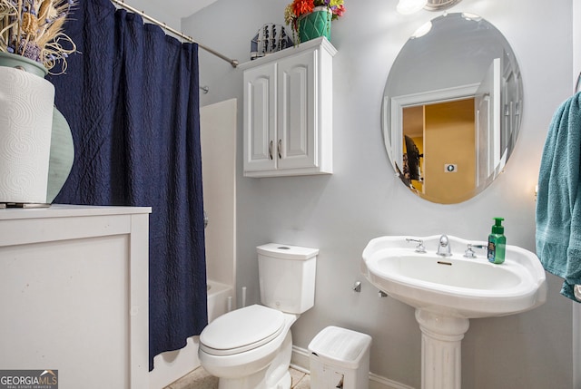 bathroom with toilet and shower / tub combo