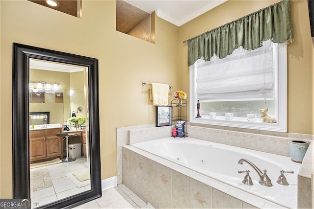 bathroom featuring tiled bath, ornamental molding, tile patterned floors, and vanity