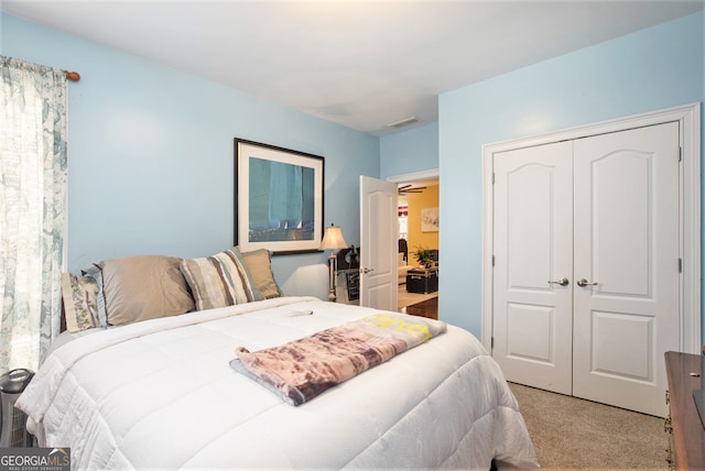 carpeted bedroom with a closet