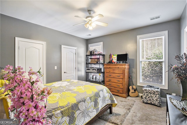 carpeted bedroom featuring ceiling fan