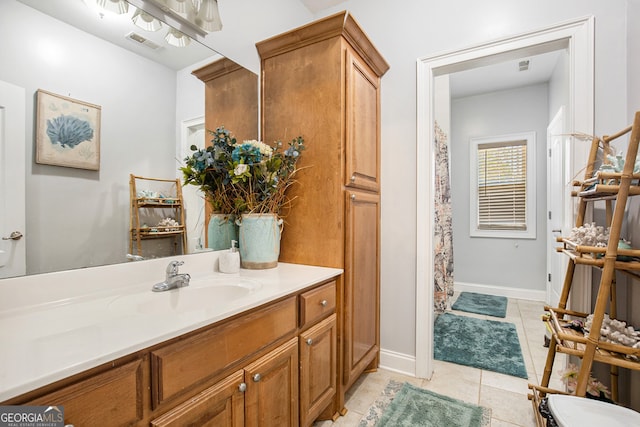 bathroom with vanity and tile patterned flooring