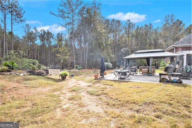 view of yard with a patio, an outdoor hangout area, and a gazebo