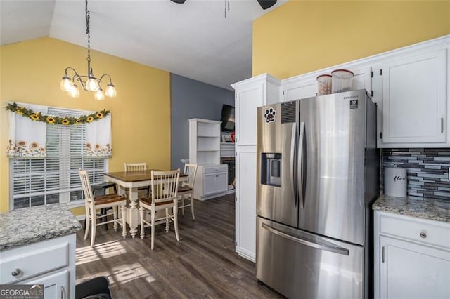 kitchen with white cabinets, dark hardwood / wood-style flooring, backsplash, stainless steel fridge with ice dispenser, and pendant lighting