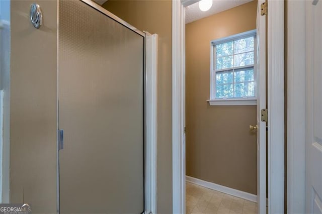 bathroom featuring an enclosed shower