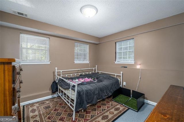 bedroom with a textured ceiling