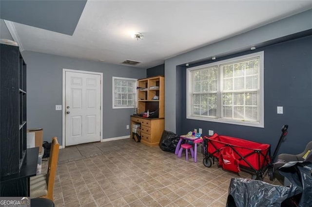 rec room with visible vents and baseboards