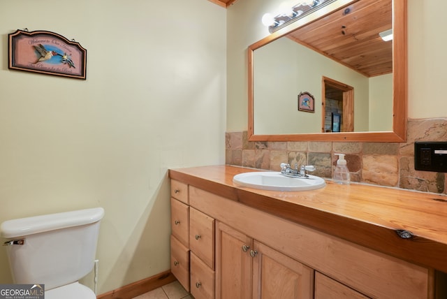 bathroom featuring wood ceiling, backsplash, toilet, tile patterned floors, and vanity