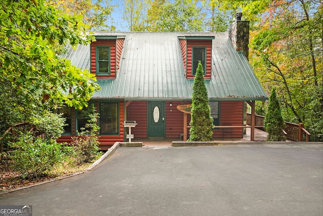 log cabin featuring a porch