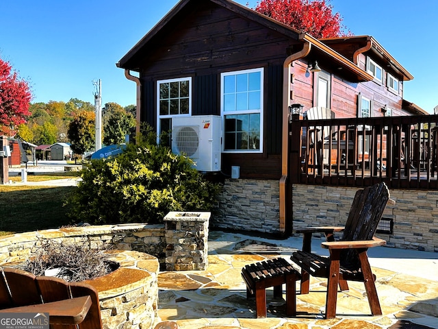 exterior space featuring ac unit and a deck