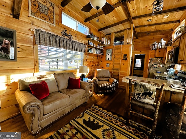 living room with wood walls, dark hardwood / wood-style floors, wooden ceiling, and ceiling fan