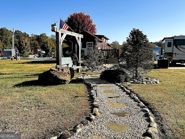 view of yard featuring a wooden deck