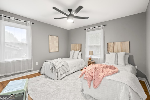 bedroom featuring wood-type flooring and ceiling fan