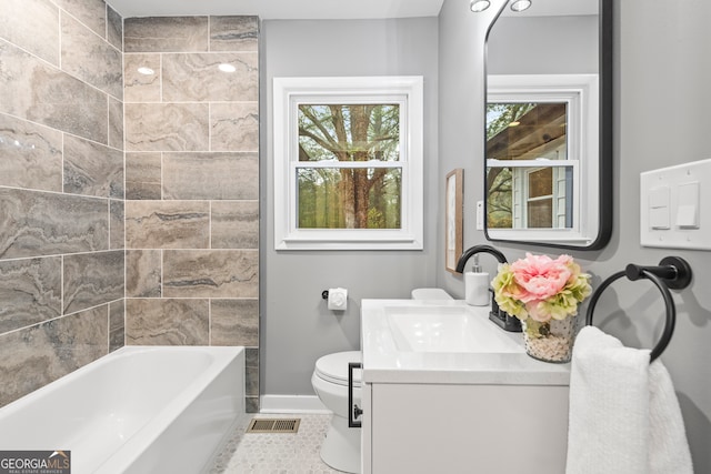 bathroom featuring tile patterned flooring, vanity, and toilet