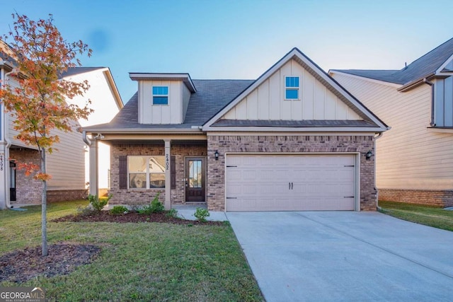 view of front of house with a front yard and a garage