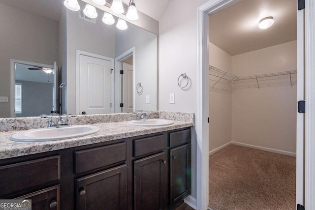 bathroom featuring vanity and ceiling fan