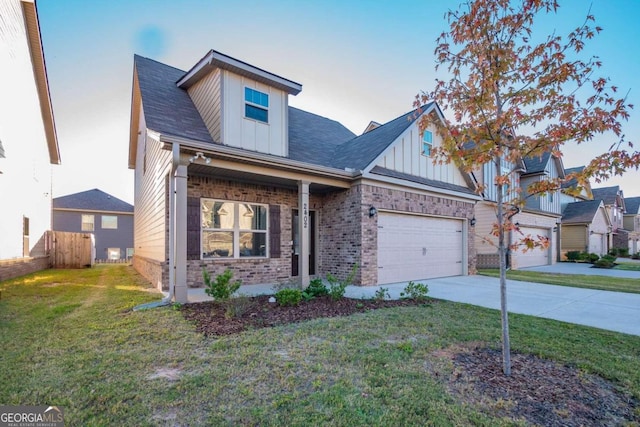 view of front facade featuring a front yard and a garage