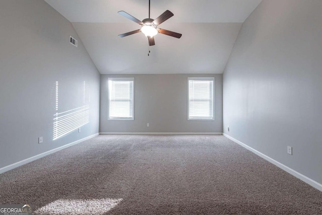 carpeted empty room featuring lofted ceiling and ceiling fan