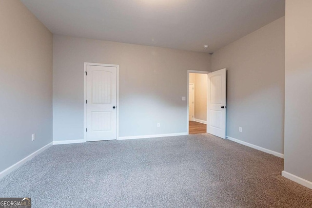 spare room with carpet floors