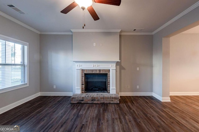 unfurnished living room with dark wood-type flooring, crown molding, and ceiling fan