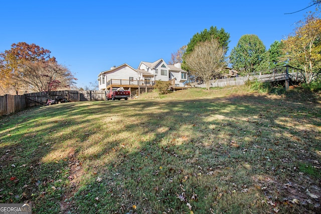 view of yard with a wooden deck