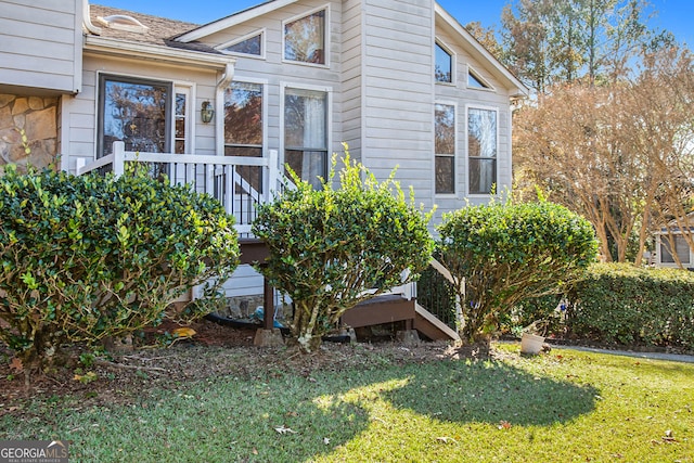 view of home's exterior with a yard