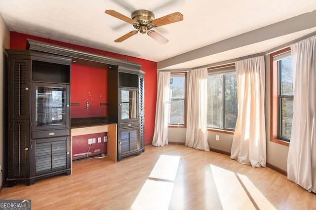 interior space featuring ceiling fan and light hardwood / wood-style flooring