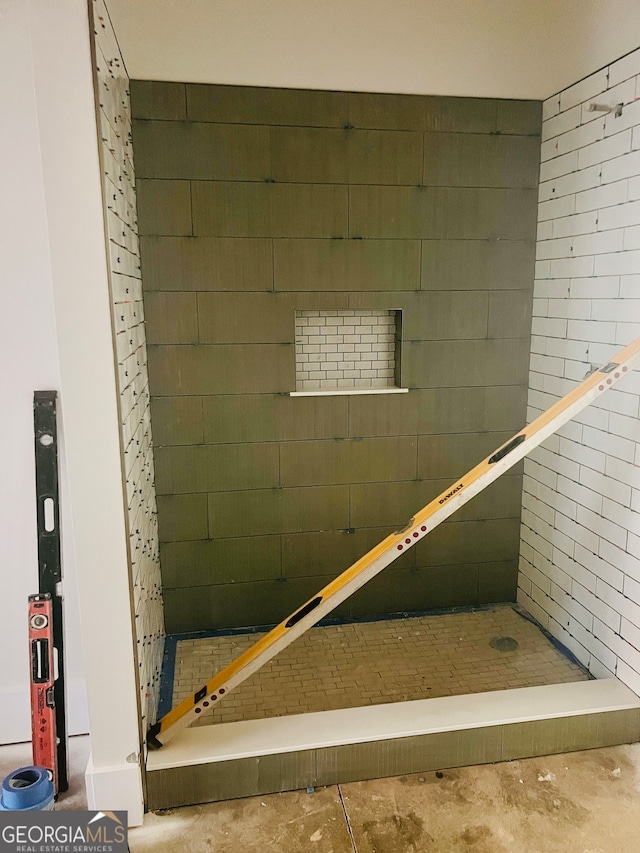 bathroom with concrete floors