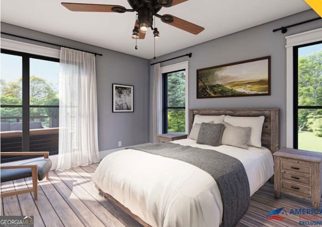 bedroom with hardwood / wood-style floors, multiple windows, and ceiling fan