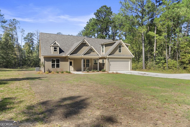 craftsman-style house featuring a garage and a front yard