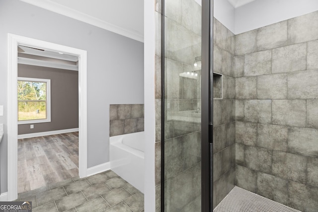 bathroom featuring hardwood / wood-style floors, ornamental molding, and shower with separate bathtub