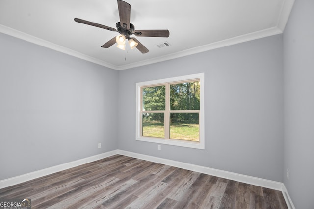 spare room featuring ceiling fan, wood-type flooring, and ornamental molding